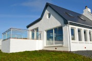 West facing balcony and floor to ceiling windows over looking Burrafirsth bay and Hermaness.