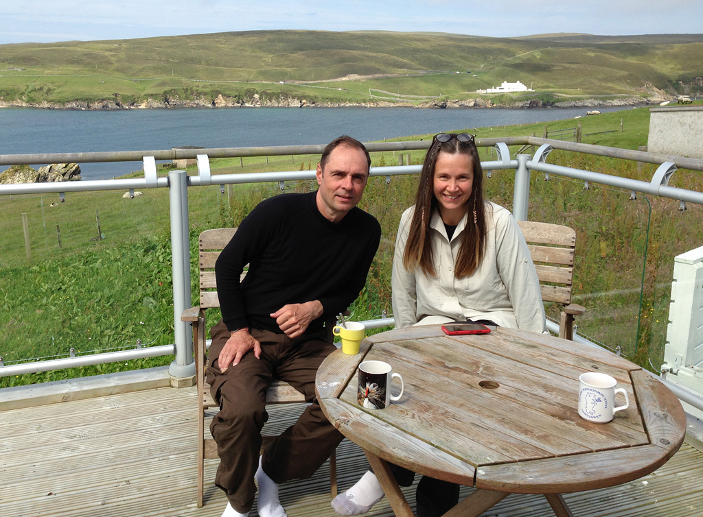 Markus and partner Minna on the balcony at the Shetland Nature Lodge. Markus-and-Minna-Lodge